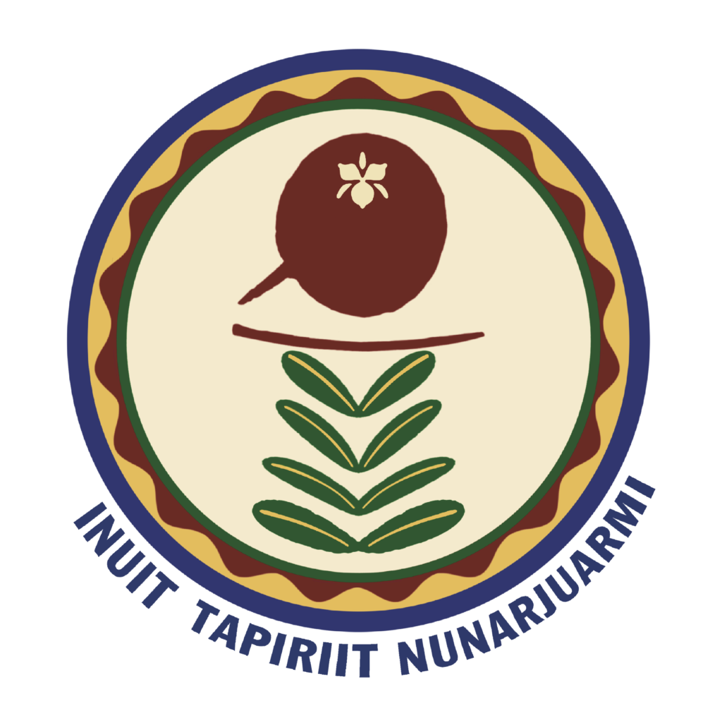 Circular emblem with a plant motif inside a cream center, surrounded by green and brown borders and a blue outer ring with curved text.